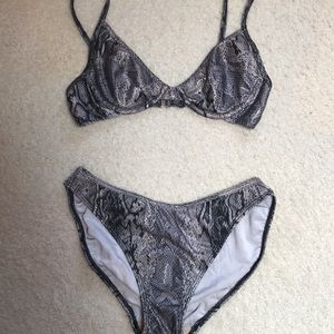 Blikini,sexy black and silver with a  shiny grey size small . Has underwire bra.
